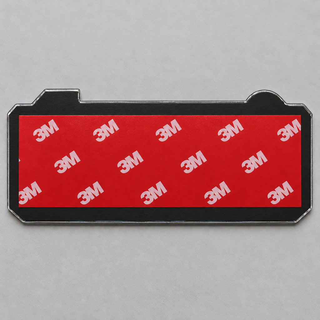 Back of the emblem: black ABS backing plate with pre-applied 3M adhesive