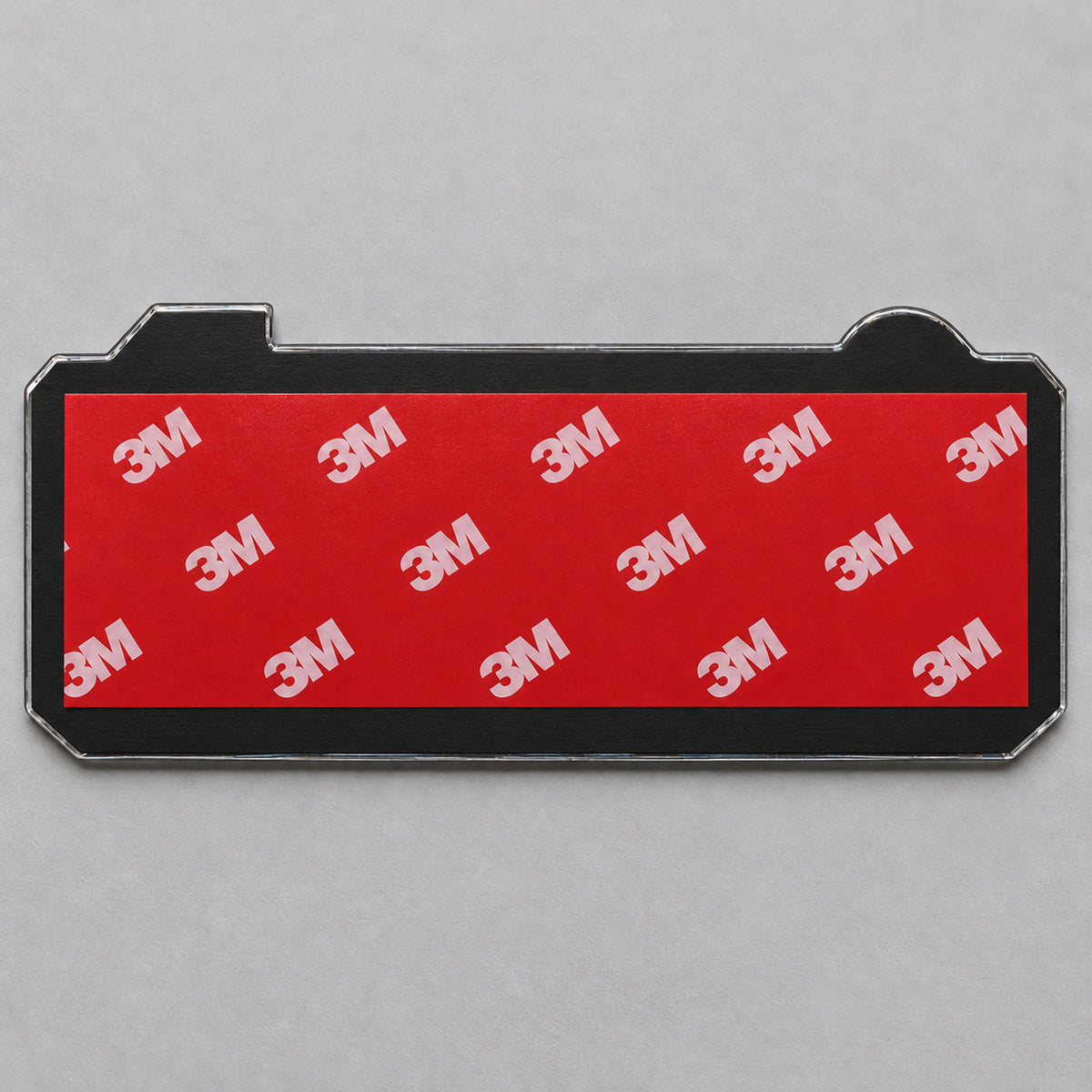 Back of the emblem: black ABS backing plate with pre-applied 3M adhesive