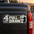 Compound bow emblem mounted on a truck tailgate, direct view