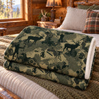 Olive Timber Bowhunt Fleece Blanket folded on a bed
