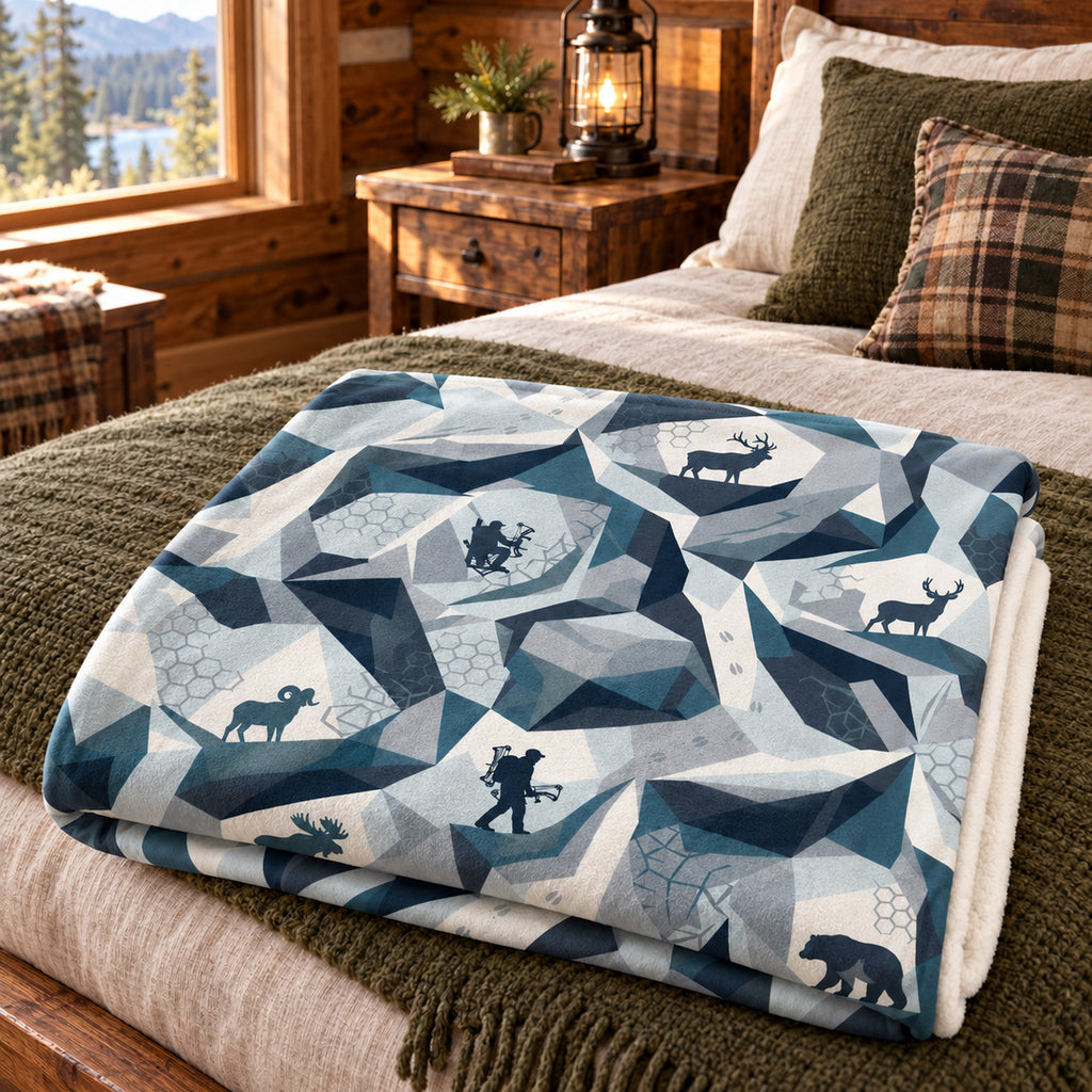 Alpine Facet Backcountry Fleece Blanket folded on a bed