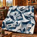 Alpine Facet Backcountry Fleece Blanket draped on a couch