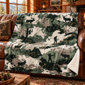 Pixel Field Elk Fleece Blanket draped on a couch