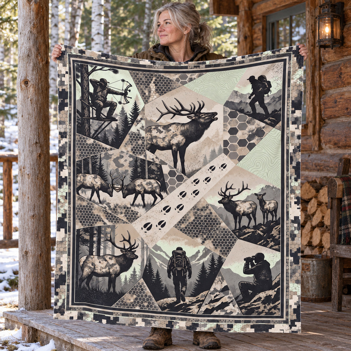 Hunter holding up the greyscale elk herd fleece blanket