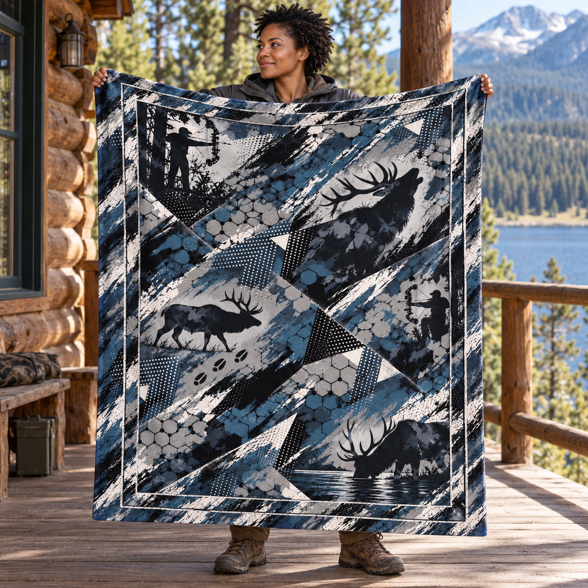 Hunter holding up the shard camo bull elk fleece blanket