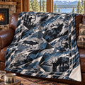 Shard camo bull elk fleece blanket draped over a cabin couch