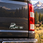 4x4 For The 6x6 bull elk emblem on a pickup truck tailgate, angle view