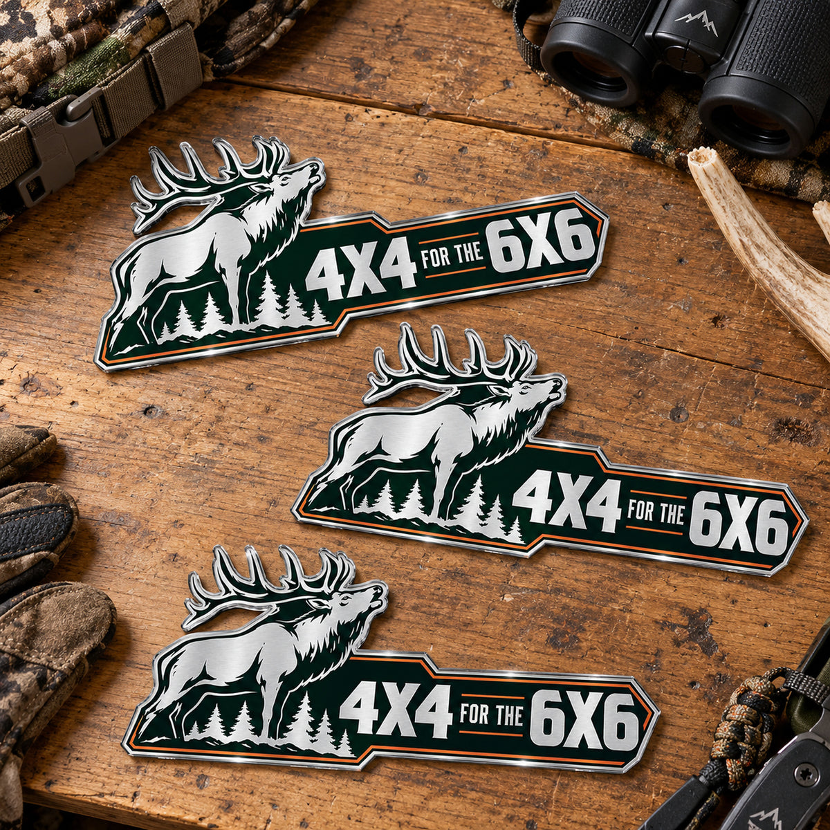 Three sizes of the bull elk metal emblem side by side