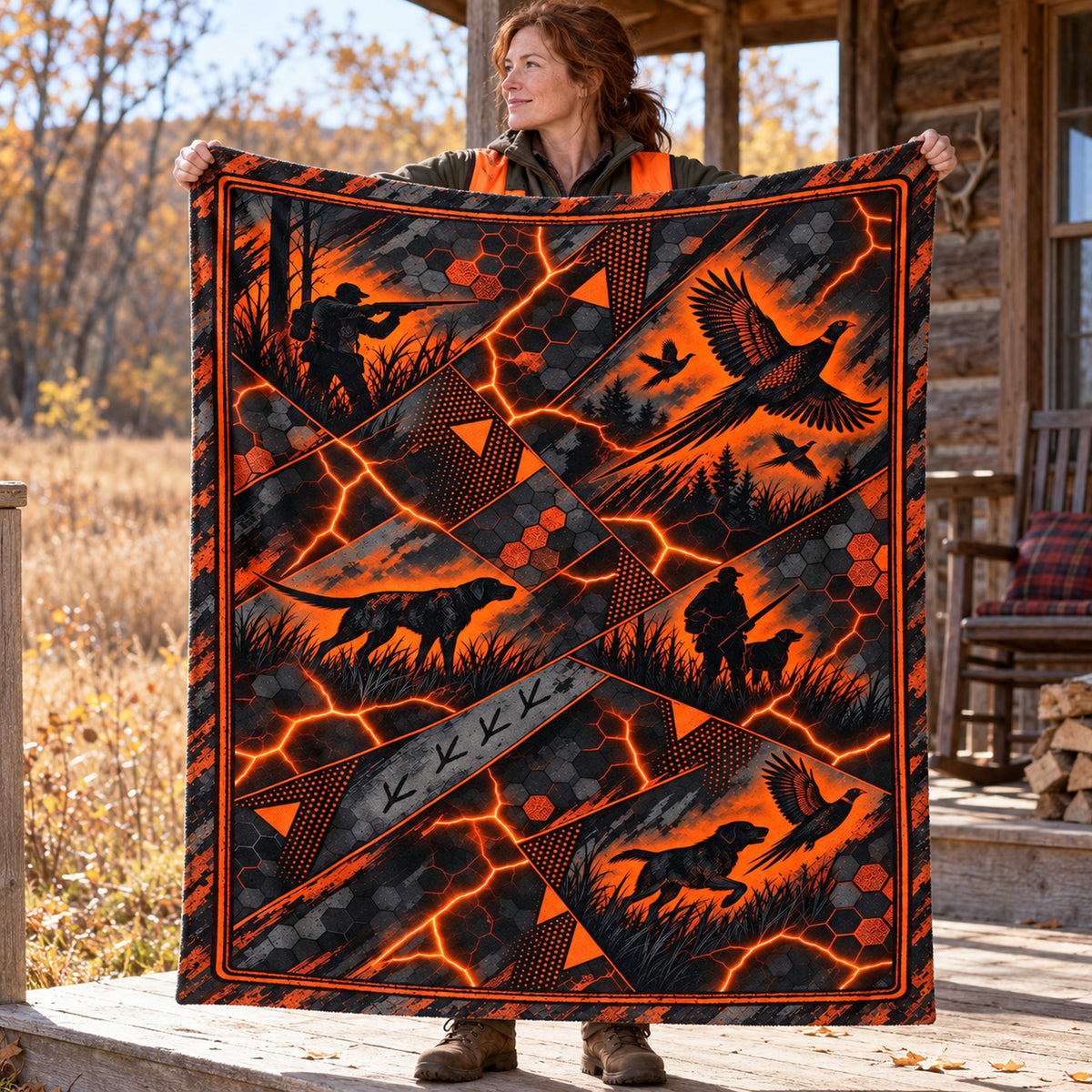 Hunter holding up the molten shard rooster fleece blanket