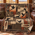 Plaid patch feather pheasant fleece blanket draped over a cabin couch