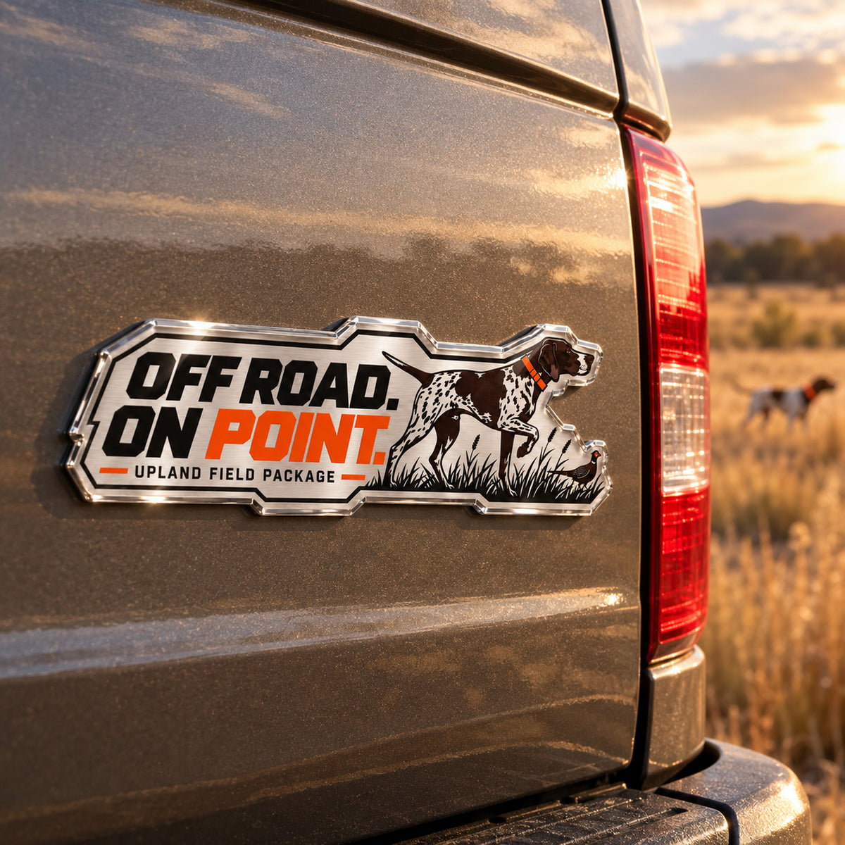 Off Road On Point metal car emblem on a pickup truck tailgate, angle view
